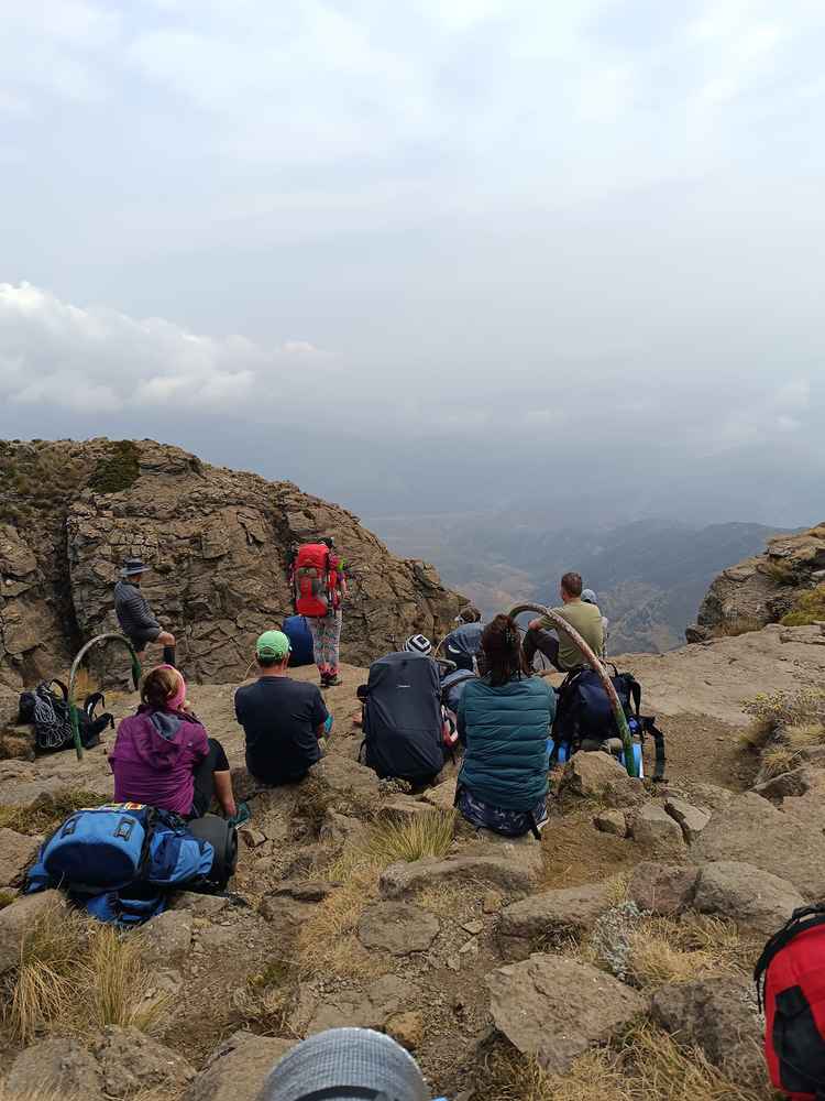 Campers take a break after conquering the infamous chain ladders hugging the cliff face. (Image by Noxolo Kapela).