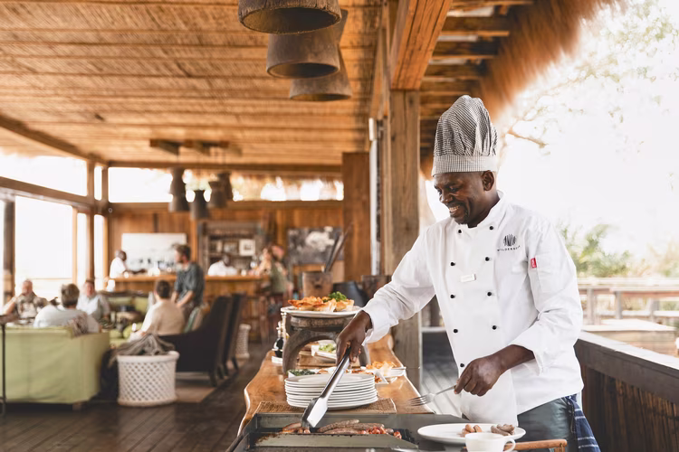 During the off-season, caretakers may remain on site through the green season, sustained by dry goods, gas and fuel stocked months in advance. (Image courtesy of Wilderness Safaris).