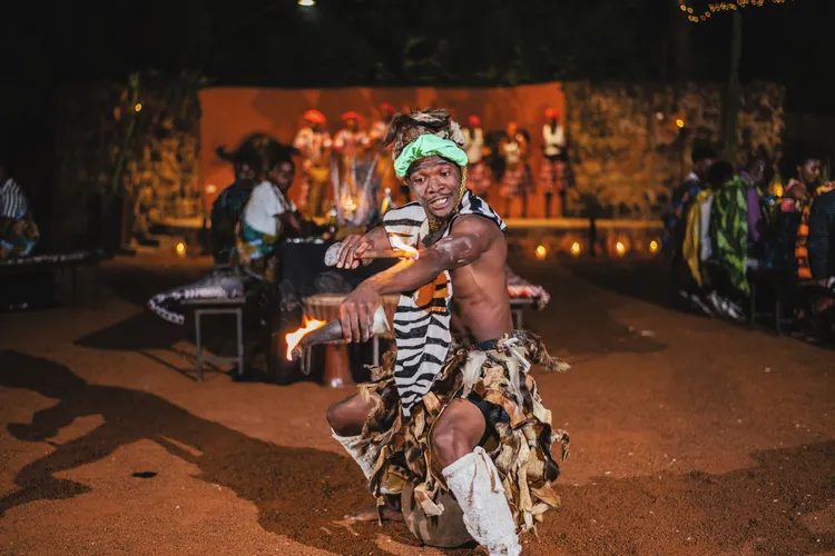 Avani Victoria Falls Resort Boma Dinner Fire Performer (Image courtesy of Avani Victoria Falls Resort).