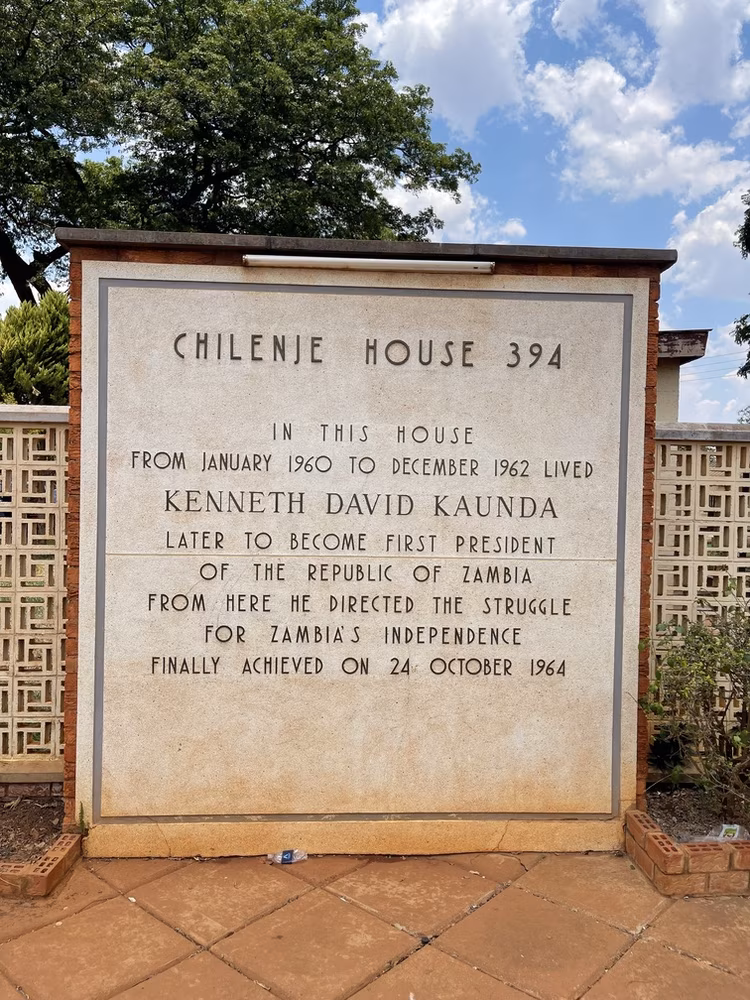 Chilenje House 394: Historic residence of Kenneth Kaunda, Zambia's first president, where he led the struggle for independence (1960–1962). The plaque commemorates his legacy ahead of Zambia's freedom in 1964. (Image courtesy of Bongani Kumar).