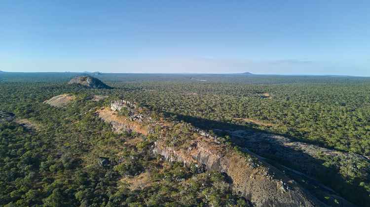 Kankonde Rock rises like the Behemoth from a sea of green miombo woodland, (image by Nkwazi/Walid Nassar).).