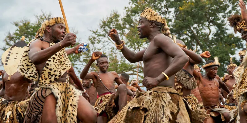 Two Ngoni warriors dancing stomping their feet in celebration of the Ncwala ceremony