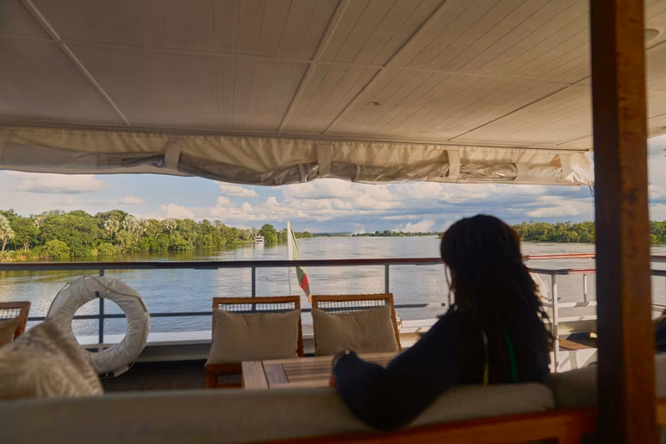 Tourism and everyday life exist side by side, shaped by history, culture, and shifting economies. (Image by Chona Mweemba for Nkwazi Magazine).