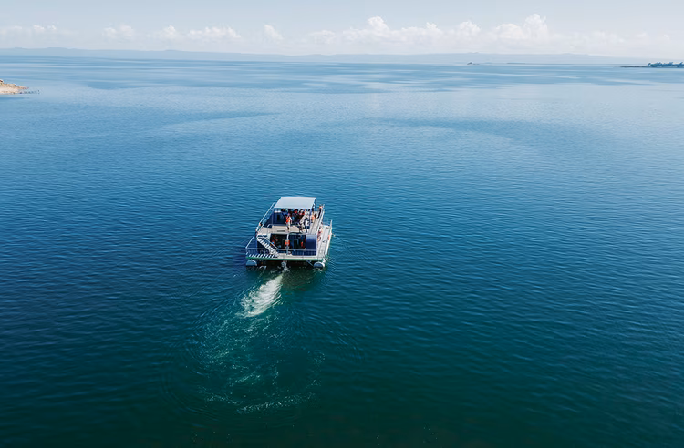A boat ride across Lake Kariba reveals secluded coves, quiet islands and the gentle rhythm of life along the Zambian shoreline. (Image courtesy of Savee Beach Resorts).