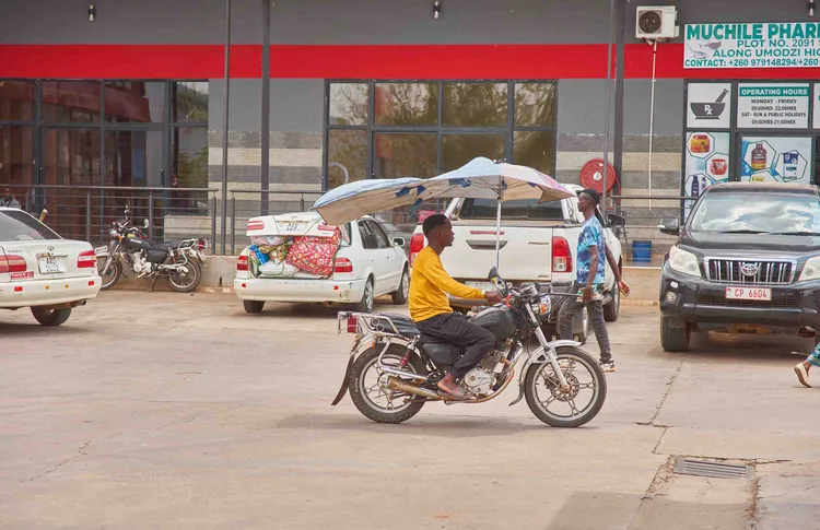 A bike taxi is a common mode of transportation in Chipata, shuttling passengers around quickly (image by Chosa Mweemba).