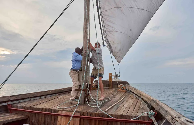 Hoisting sail as the wind picks up over the lake(image by Chosa Mweemba).