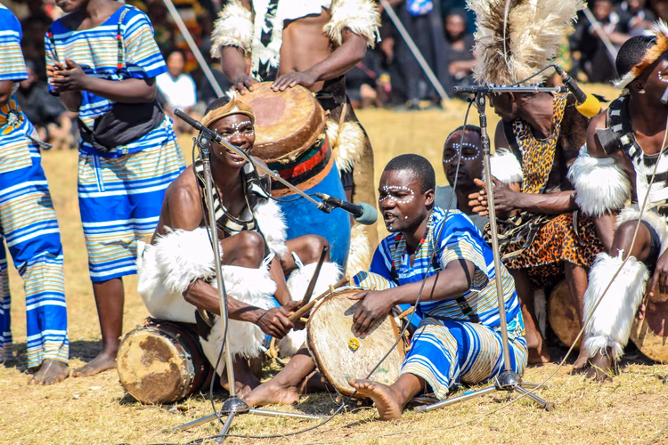 The ceremony is a fundamental act of thanksgiving where communities present the first harvest to ancestors, expressing gratitude while asking for future rains too. (Image courtesy of Ohau Media Zambia).