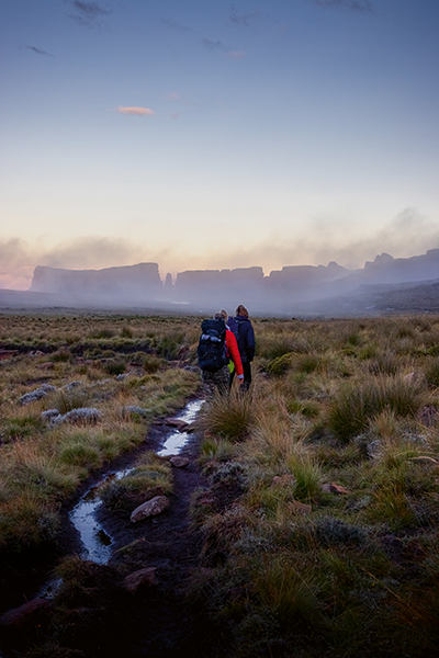 Hikers trek through the early morning mist. (Image by Lenka Znamenackova).