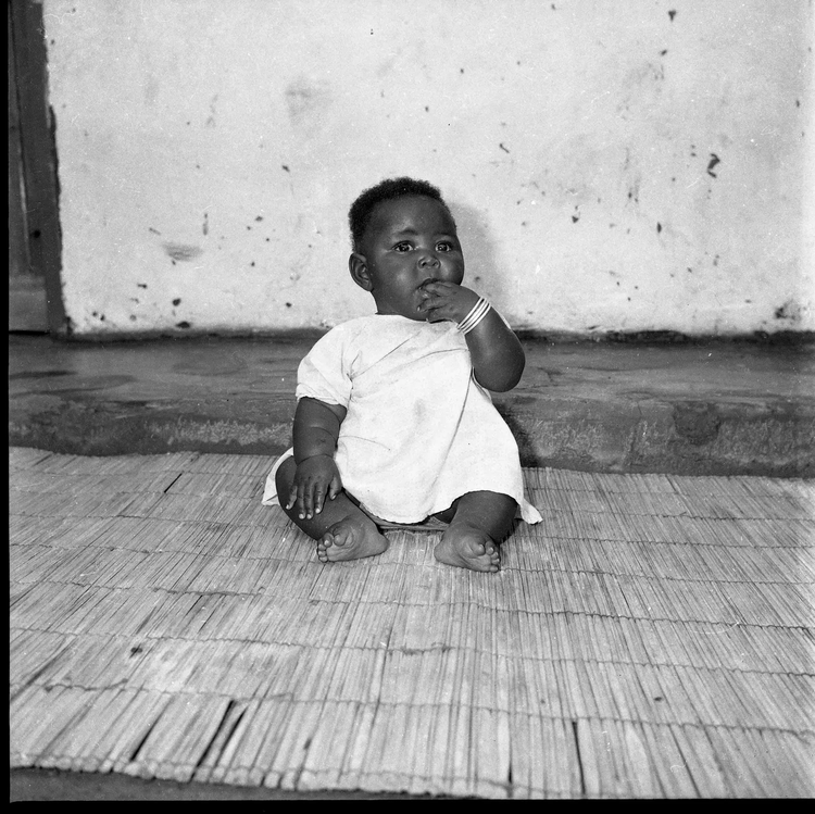 He photographed families and friends within their homes or streets, sometimes capturing candid moments. (Image by Alick Phiri).