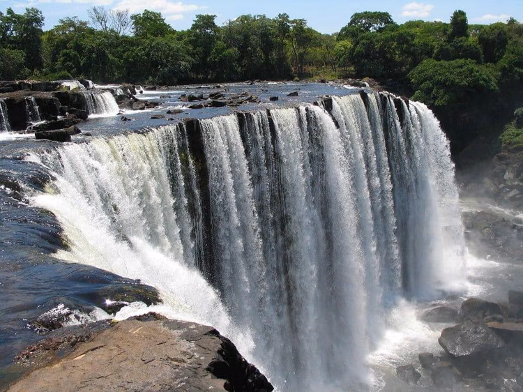 Around 35 metres high and 100 metres wide, Lumangwe Falls creates a broad curtain of water along the Kalungwishi River in Northern Province. (Image courtesy of Zambia Tourism).