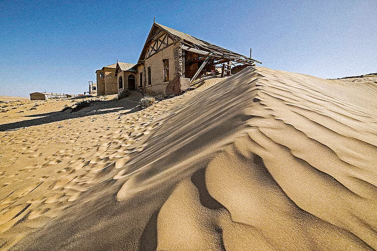 At the time of its boom, it was replete with amenities, housing everything from a hospital to a theatre. Now all has been consumed by the desert. (Image courtesy of Namibia Tourism Board).