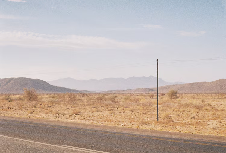 Kazungula road is smooth, but soon begins to fracture; travelling on a road that shifts between a dirt road resembling corrugated roof sheeting and bits of tar. (Image courtesy of Sebastian Moronell).