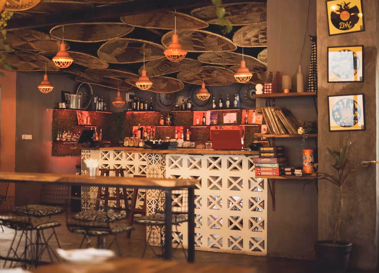 Woven baskets adorning the ceiling and the vibrant prints covering the walls reflect The Gathering’s distinctly Zambian identity.(Image courtesy of The Gathering).