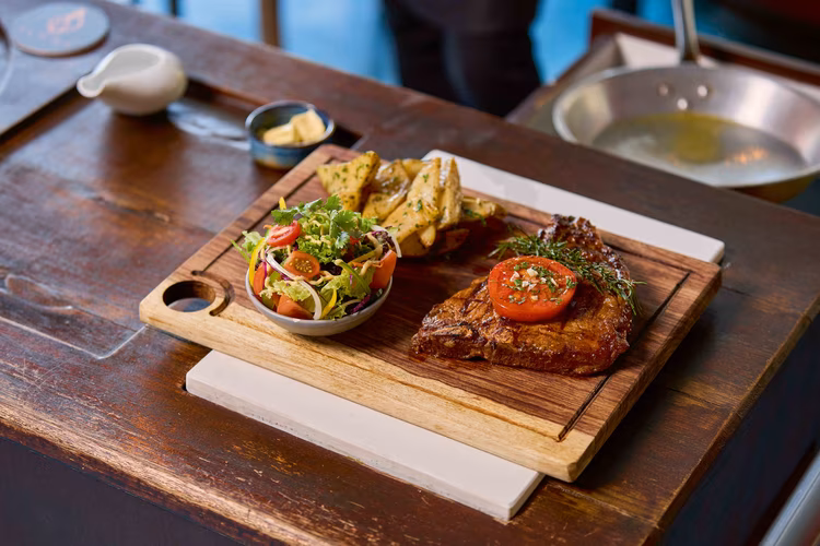 The ambience of Flame Restaurant sets the stage for an exceptional dining experience. The friendly, attentive staff enhance the enjoyment of a creatively crafted fusion menu. (Image by Justine Kunda for Nkwazi Magazine).
