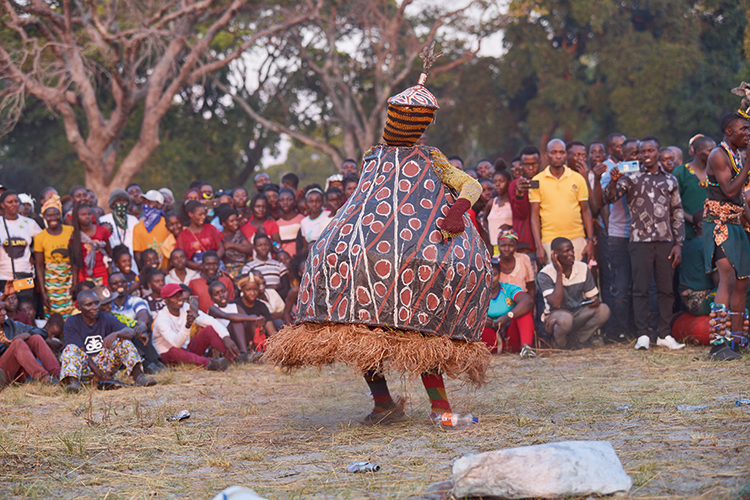 Nyakasema. The pregnant one. It is believed that her performance gives birth to other makishi during the ceremony. (Image by Nkwazi/Justine Kunda).