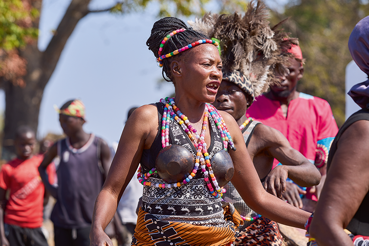 A member of the Chota cha Chokwe Cultural Troupe showcases her dancing skills. (Image by Nkwazi/Justine Kunda).