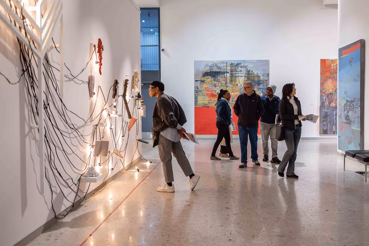 Visitors were invited to draw portraits of loved ones lost to the pandemic, write about their experiences on a wall, or hang tribute cards in the gallery. (Image courtesy of Wits Art Museum).