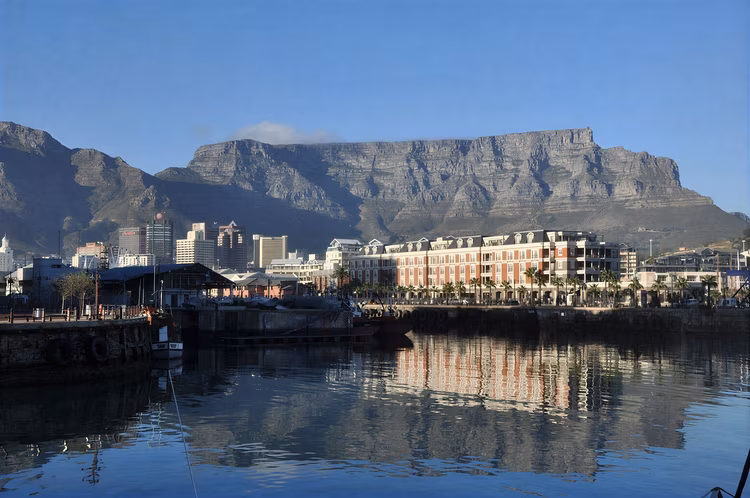 Cape Town showcases the stunning Table Mountain, pristine beaches like Clifton and Maiden’s Cove, and the iconic Boulder’s Beach penguin colony.