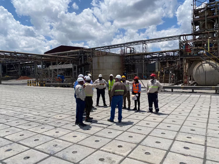 Mine workers gather for a routine safety briefing before the start of a shift. These daily checks help teams identify hazards and ensure work only begins once risks are understood and controlled. (Image courtesy of First Quantum Minerals).