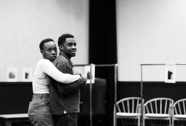 A tender moment between cast members during rehearsals. (Image courtesy of Natasha Mumba).
