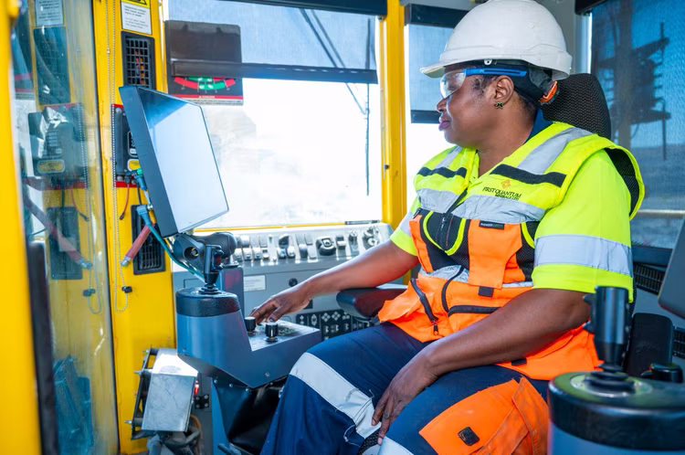 Hellen Chababa operates a rotary blasthole drill rig better known as the Pit Viper, a role she earned after nearly two decades in the sector (Image courtesy of First Quantum Minerals).