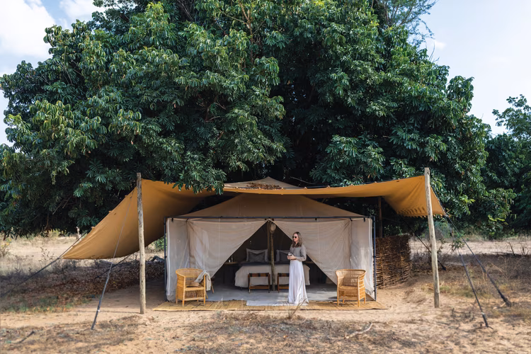 Watch the sunset over the horizon as birds serenade you with a song of tranquillity. Image courtesy of Classic Zambia safaris).