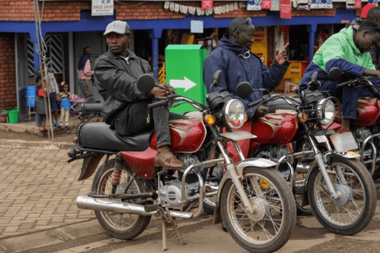 Motorbike couriers await delivery orders.