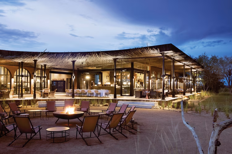 Spend relaxed evenings sipping your favourite blend around the boma fire, as your guides regale you with stories and legends of the bush. (Image by Elsa Young for Nkwazi Magazine).
