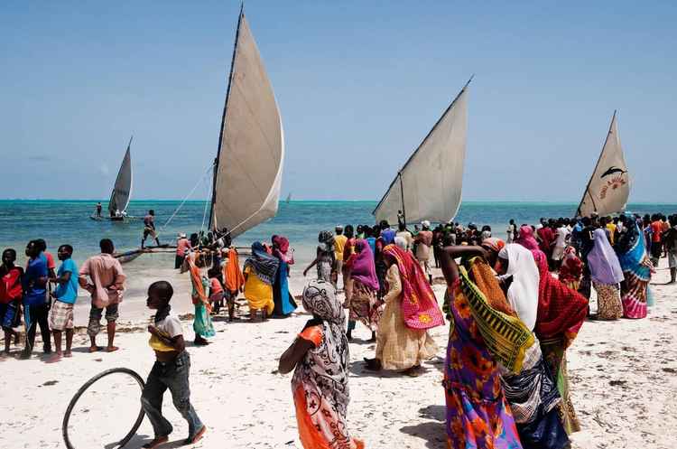 Locals flock to a beach in Zanzibar